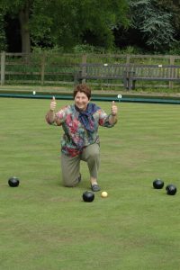 Image of a French visitor playing bowls during a visit to Winslow organised by the Winslow Anglo French Twinning Association
