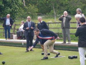 Image of the Mayor of Cours having a go at bowls during a visit by the French organised by the Winslow Anglo French Twinning Association