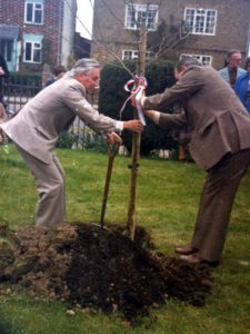 Image of M. Vermorel and Councillor Collins planting a tree at Winslow Health Centre in 1981